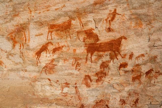 cave paintings on a rock communication